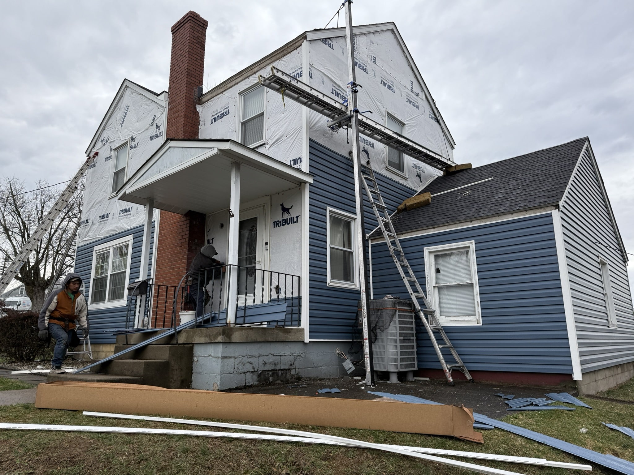 a home in Pittsburgh, PA, in the process of a new siding installation from the experts at D1 Roofing