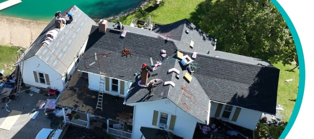 a team of roofers performs emergency roof repair on a home in Cincinnati, OH