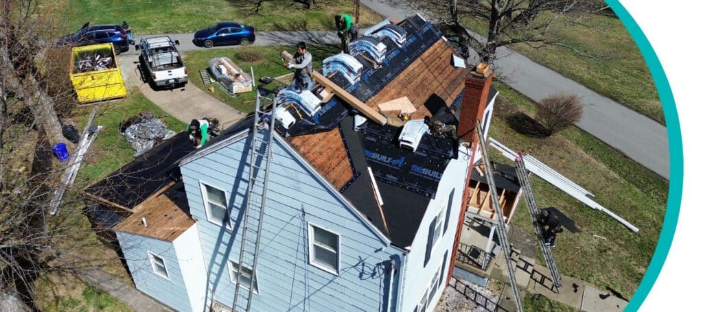 A team of roofing professionals performs storm damage roof repair on a home in Pittsburgh, PA